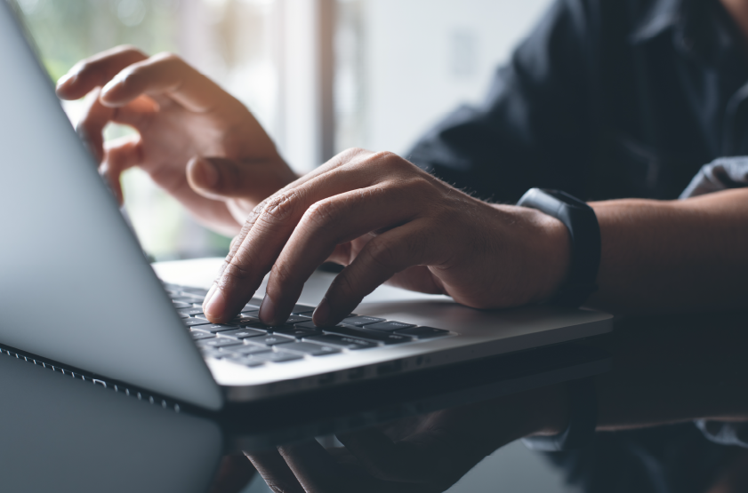 marketing professional working on a laptop